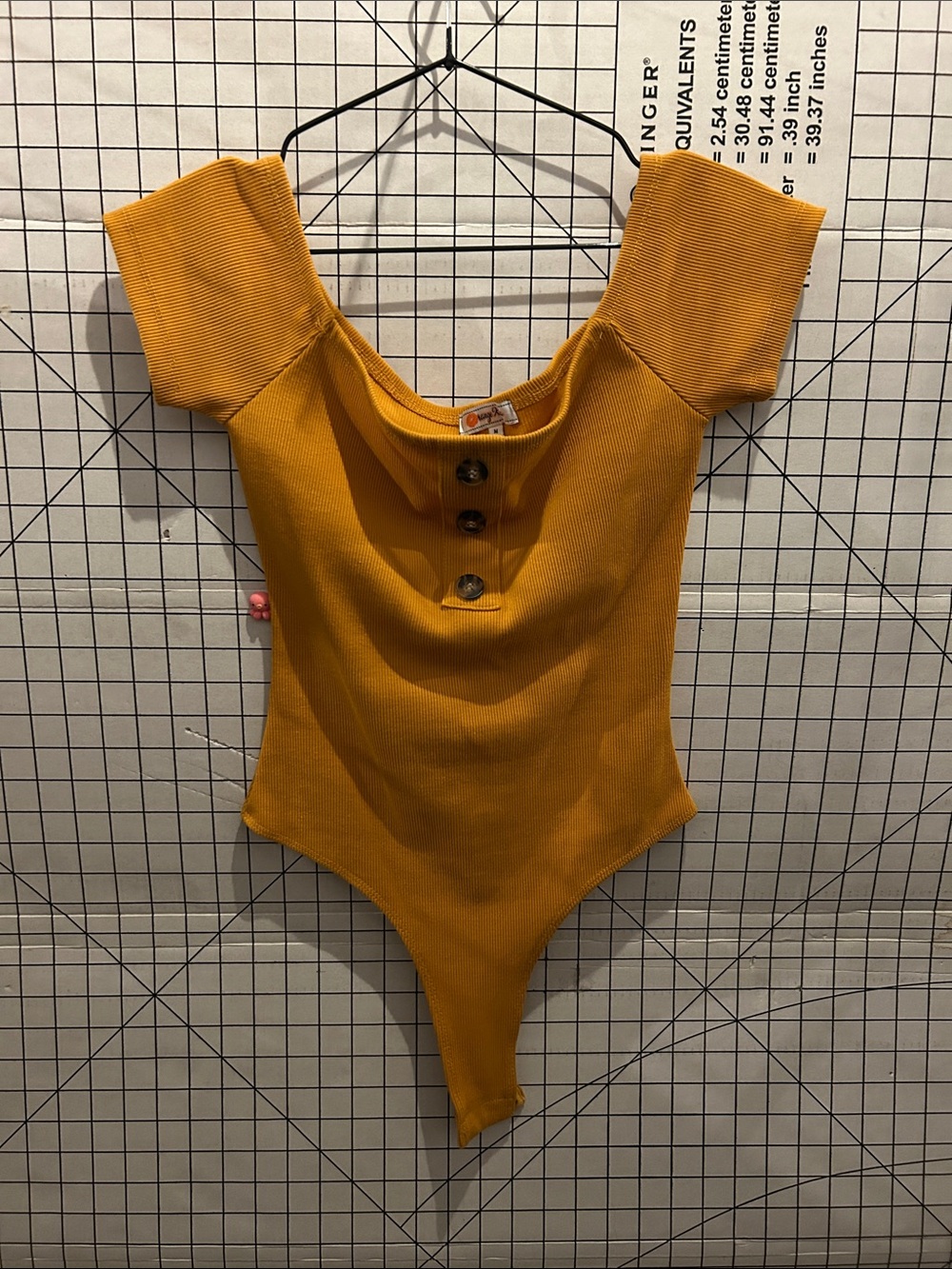Orange Kiss Ribbed Button-Front Bodysuit in Mustard
